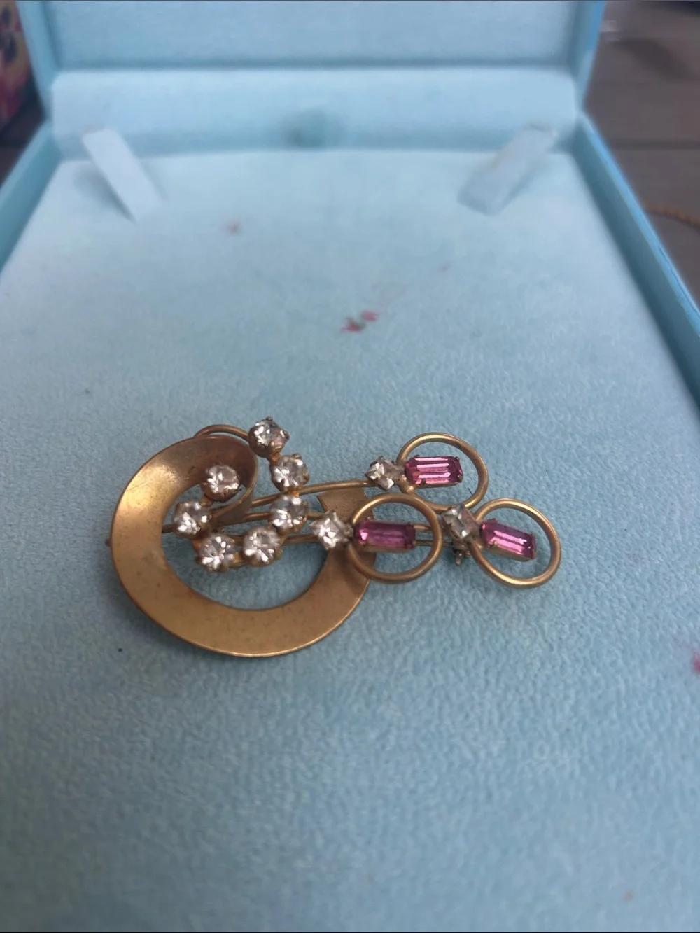 Vintage gold tone brooch with pink and clear rhinestones